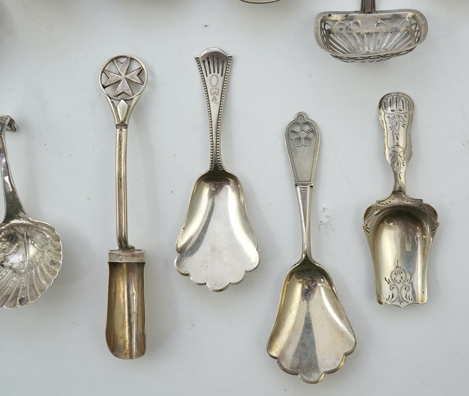 A collection of seventeen mainly 19th century Dutch white metal caddy spoons
